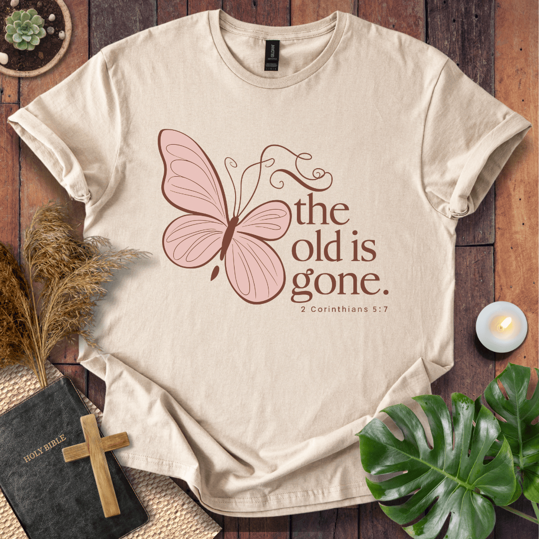 t-shirt with a dusty rose butterfly and "the old is gone" 2 Corinthians 5:17 text in brown ink.