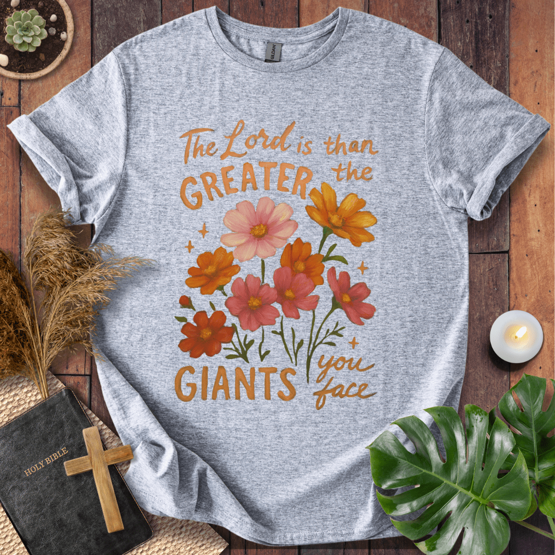 “The Lord is greater than the giants you face” floral lettering Christian t-shirt; uplifting faith tee.