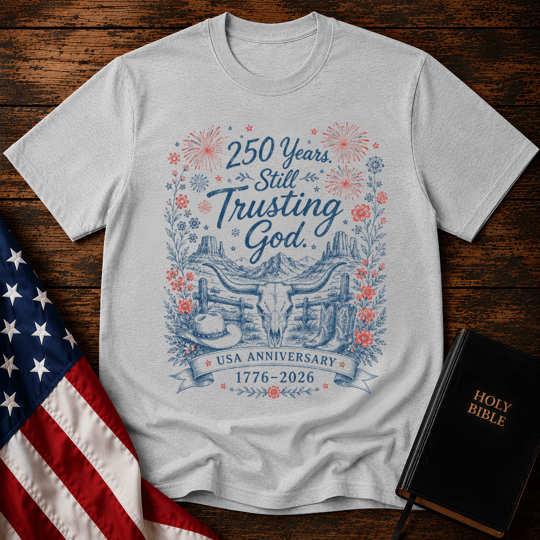 patriotic western graphic tee featuring a longhorn skull, cowboy boots, fireworks, and 1776-2026 text.