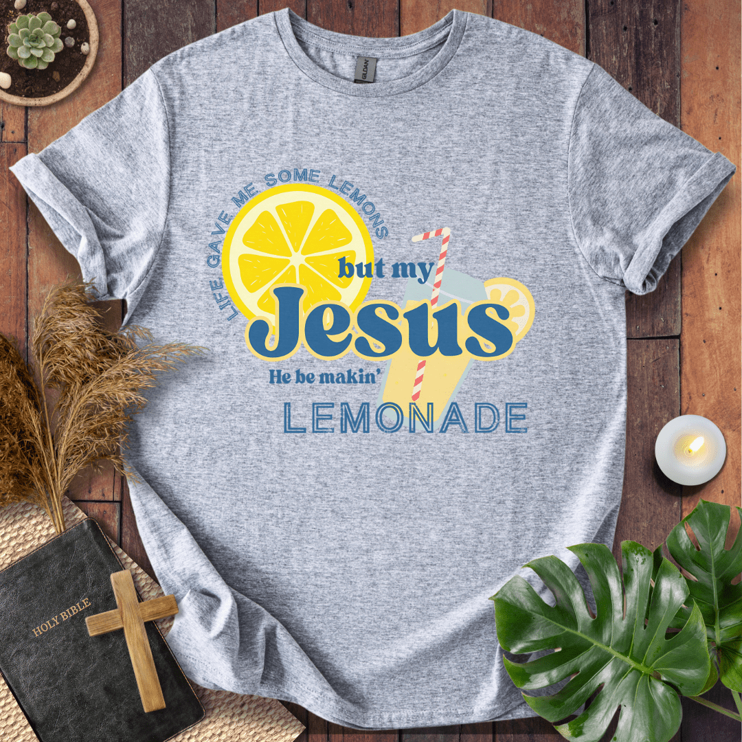 “Life gave me lemons but my Jesus makes lemonade” Christian t-shirt with bold lemon and straw graphic; playful faith tee.