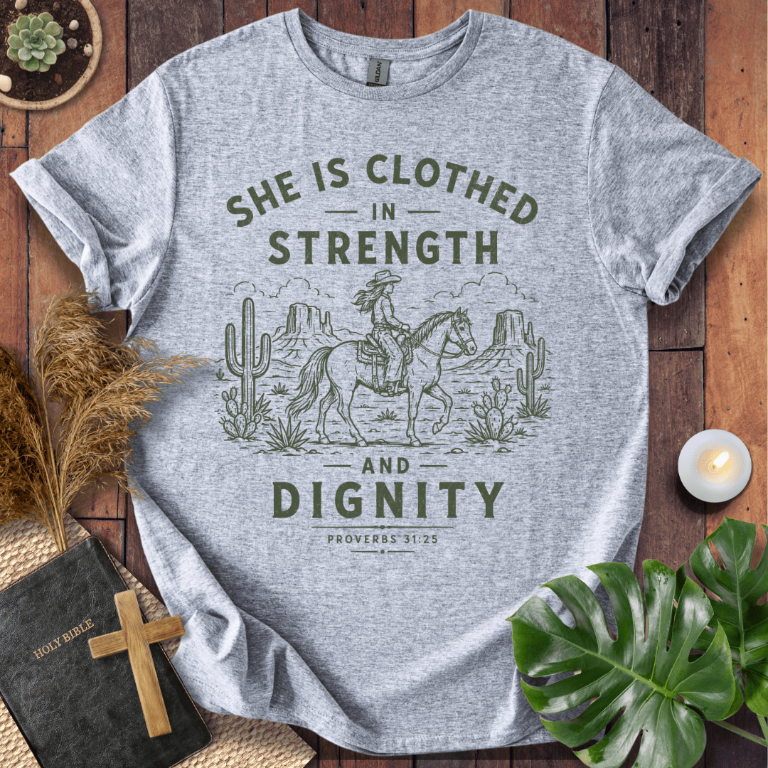 Proverbs 31 bible verse tees featuring a vintage sage green design of a cowgirl riding a horse in a desert landscape.