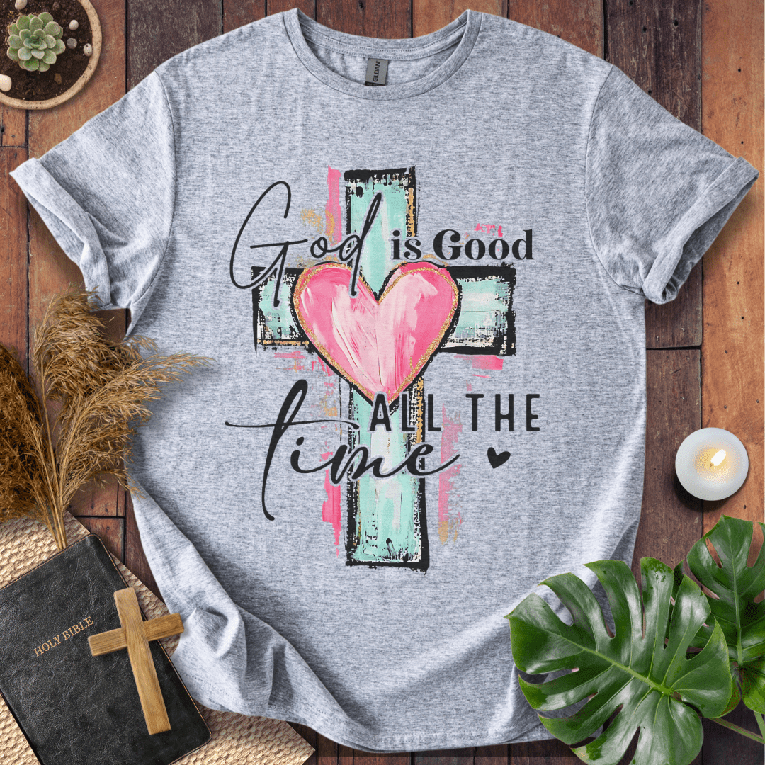 God is Good All the Time Christian t-shirt—brushstroke cross with heart and hand-lettered script.