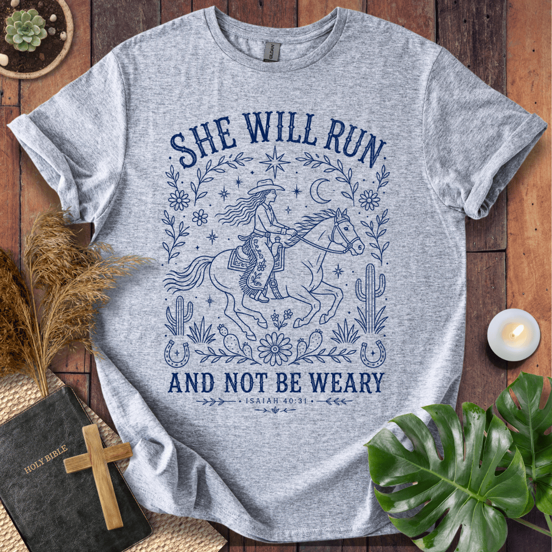 Isaiah 40:31 She Will Run scripture quote on a shirt featuring a navy line art cowgirl riding a horse.