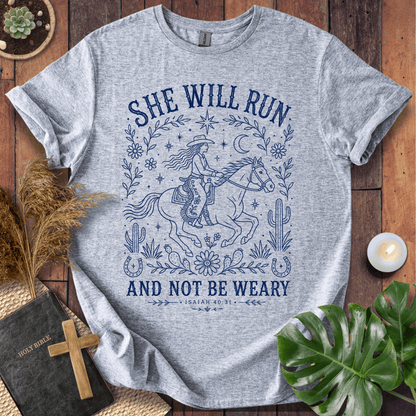 Isaiah 40:31 She Will Run scripture quote on a shirt featuring a navy line art cowgirl riding a horse.