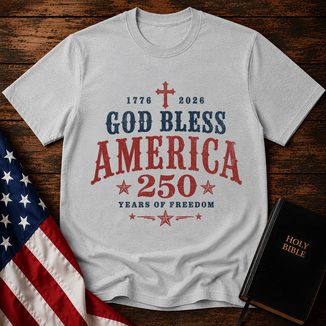 God Bless America 250 Years of Freedom t-shirt next to a Holy Bible and US flag