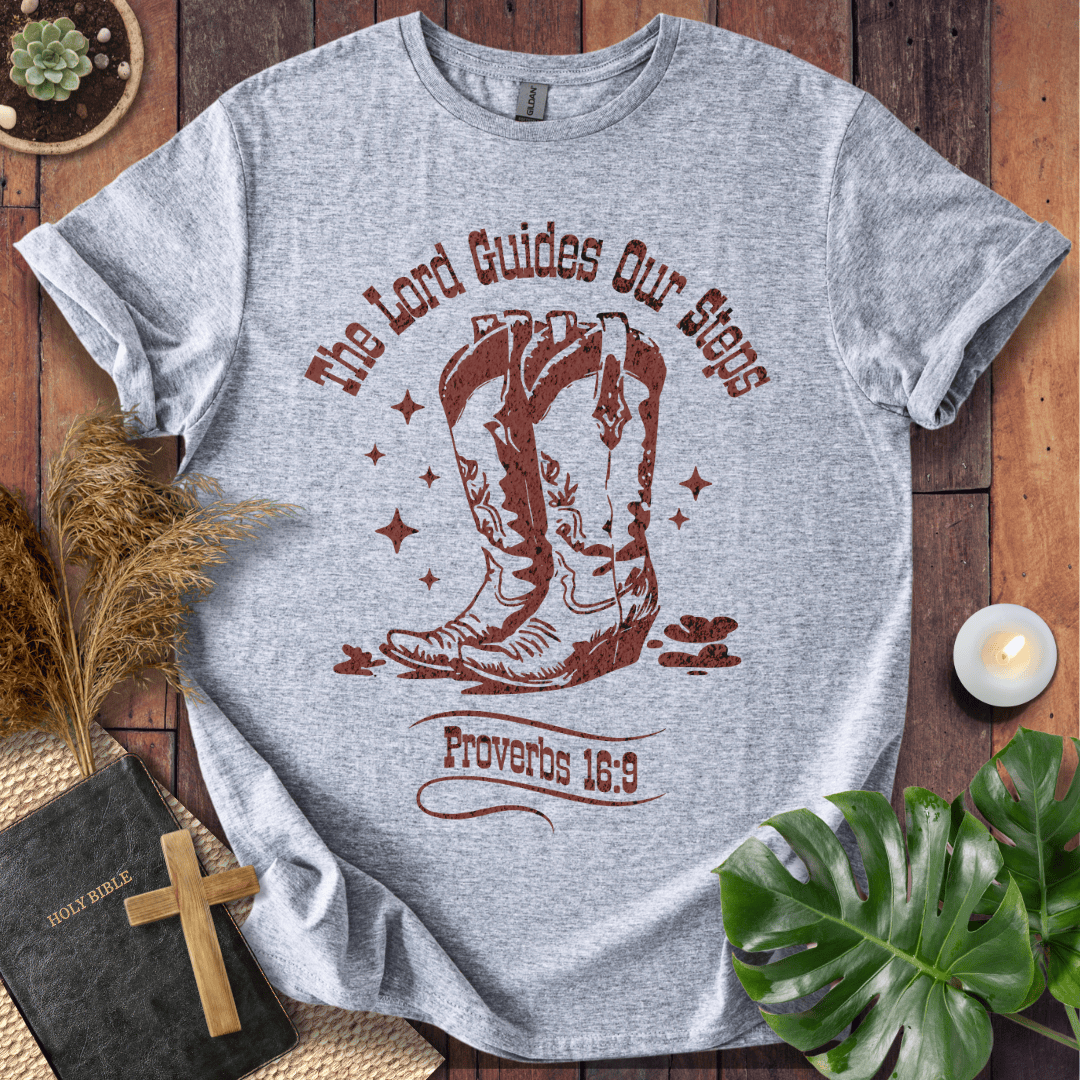 Proverbs 16:9 Christian t shirts for women featuring vintage cowboy boots and "The Lord Guides Our Steps"