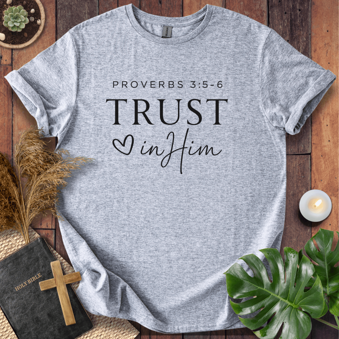 Minimalist Proverbs 3:5-6 Trust in Him shirt for women, a boho style bible verse t shirt on a wooden background.