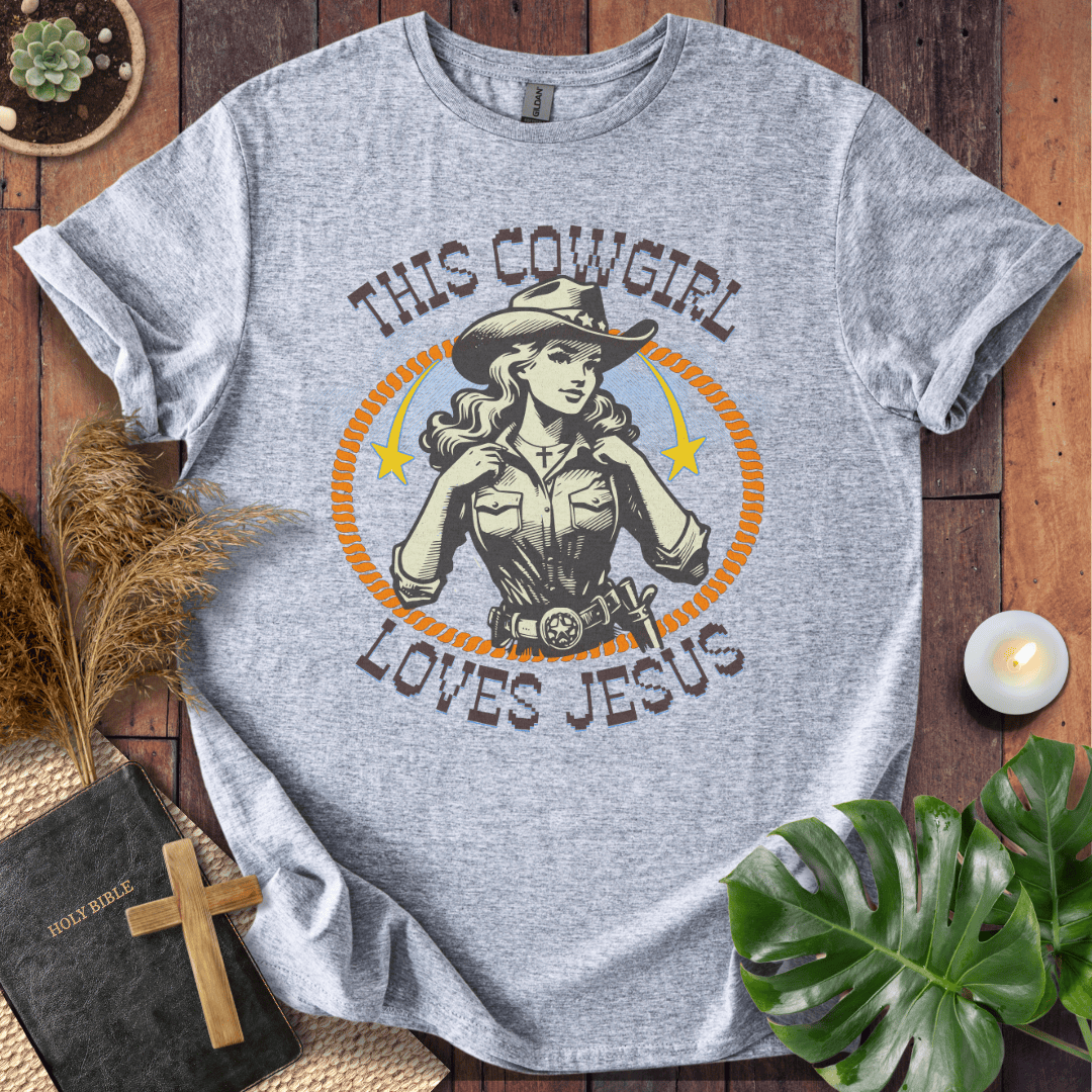 Christian t-shirt featuring a vintage cowgirl illustration with a lasso and the text This Cowgirl Loves Jesus.