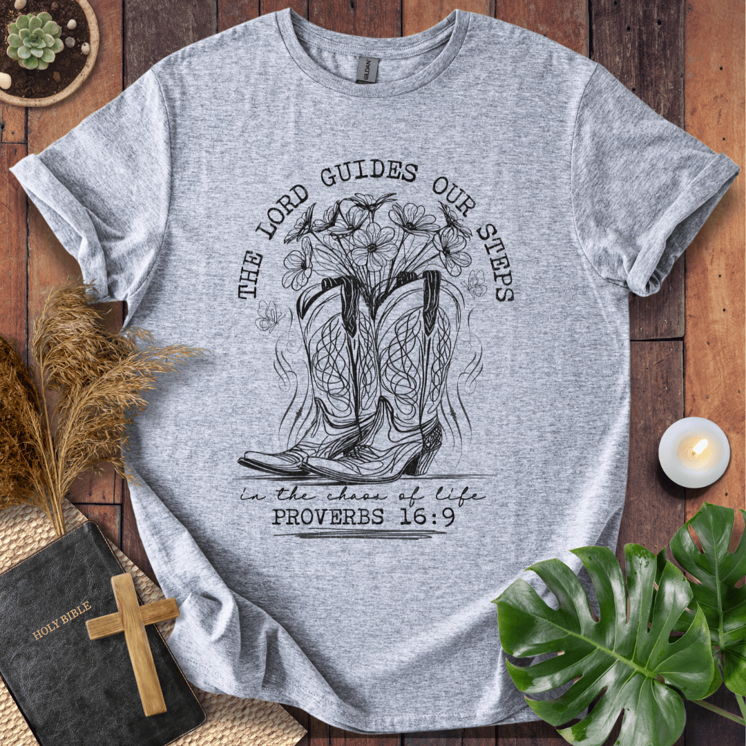 Western cowboy boots with wildflowers and butterflies on shirt with Proverbs 16:9 Bible verse text.