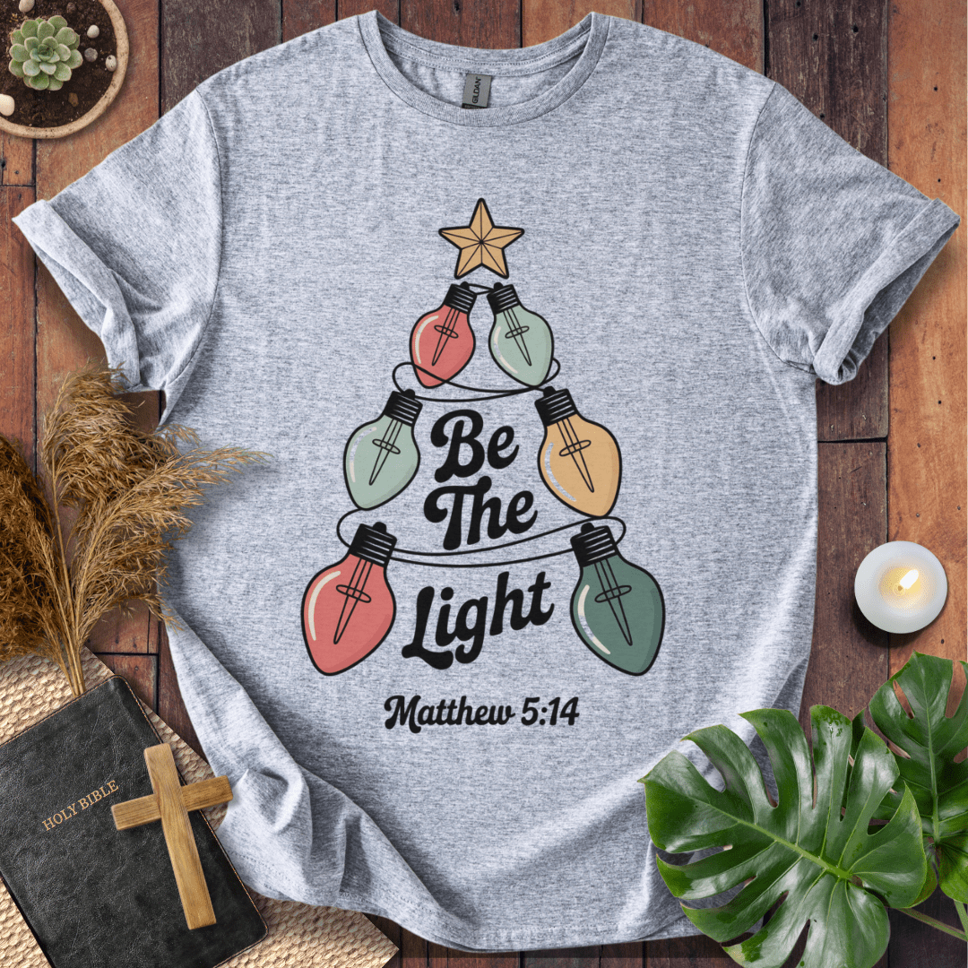 Faith Christmas shirt encouraging believers to shine their light – religious holiday tee