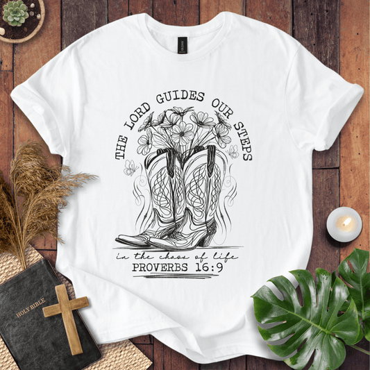 Western cowboy boots with wildflowers and butterflies on shirt with Proverbs 16:9 Bible verse text.