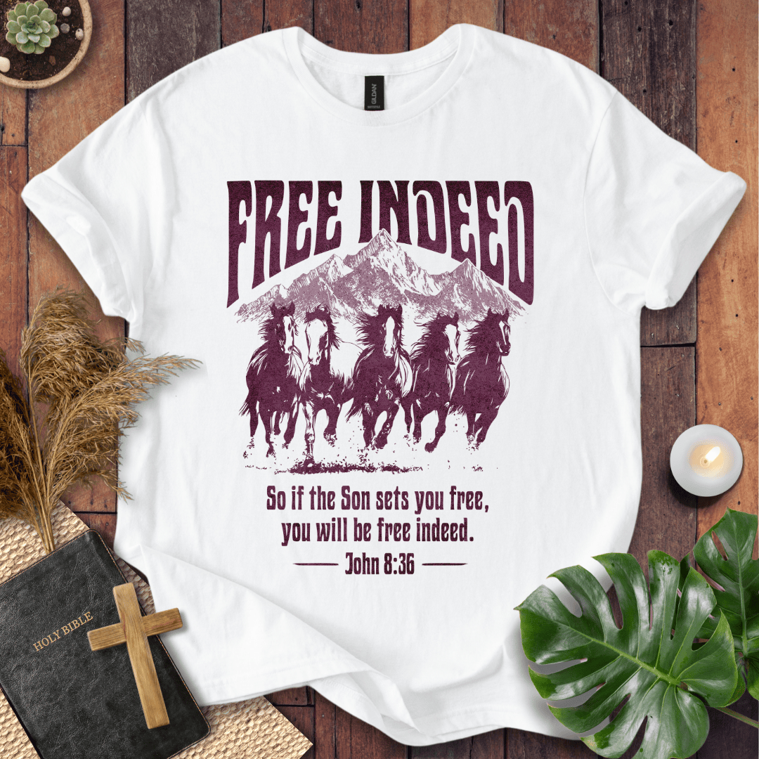 t-shirt featuring five wild horses, mountains, and John 8:36 "Free Indeed" in a vintage distressed print.