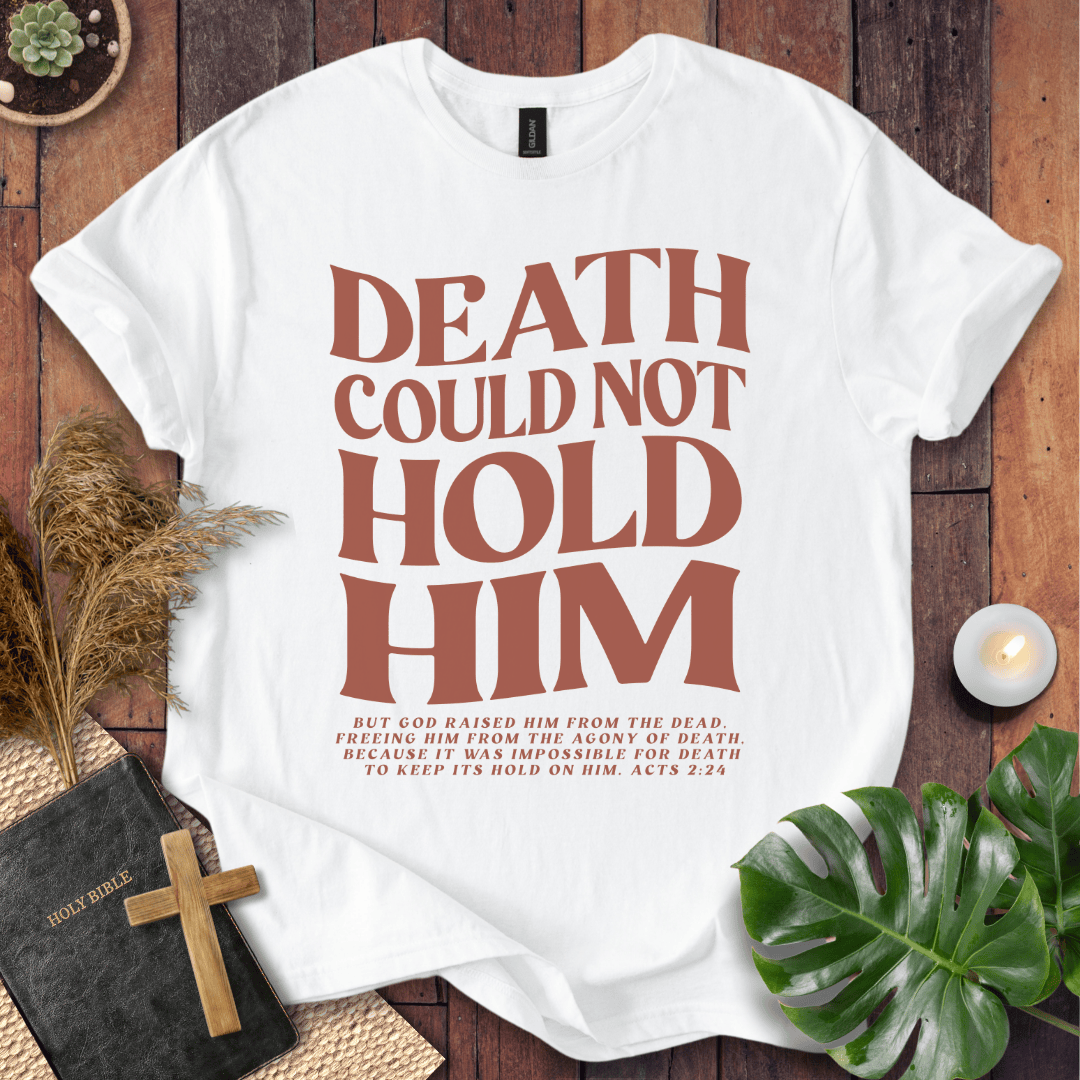 Christian Easter t-shirt with "Death Could Not Hold Him" Acts 2:24 text, styled with a Bible and wooden cross