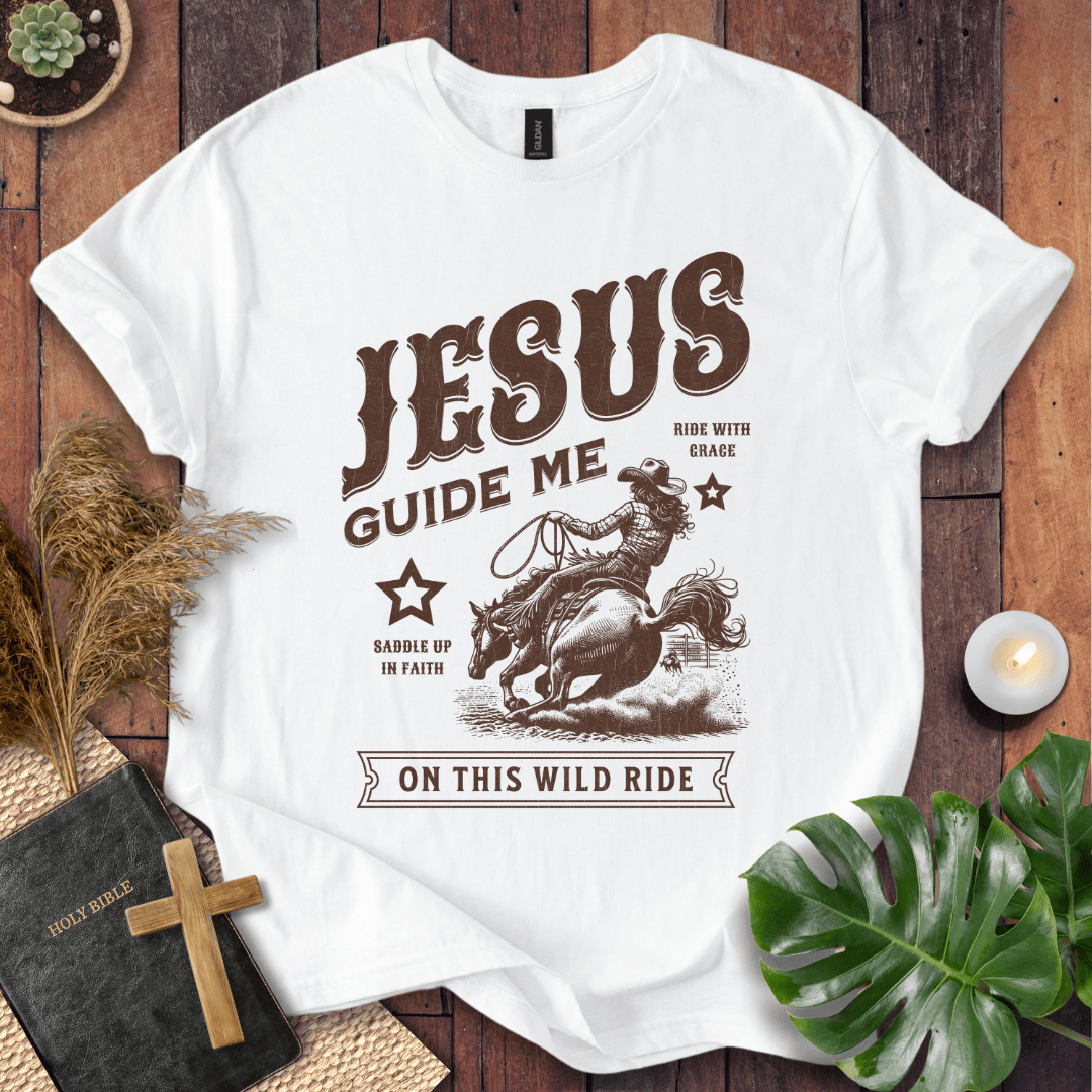 Vintage style t-shirt with a cowgirl riding a horse and text reading Jesus Guide Me On This Wild Ride.