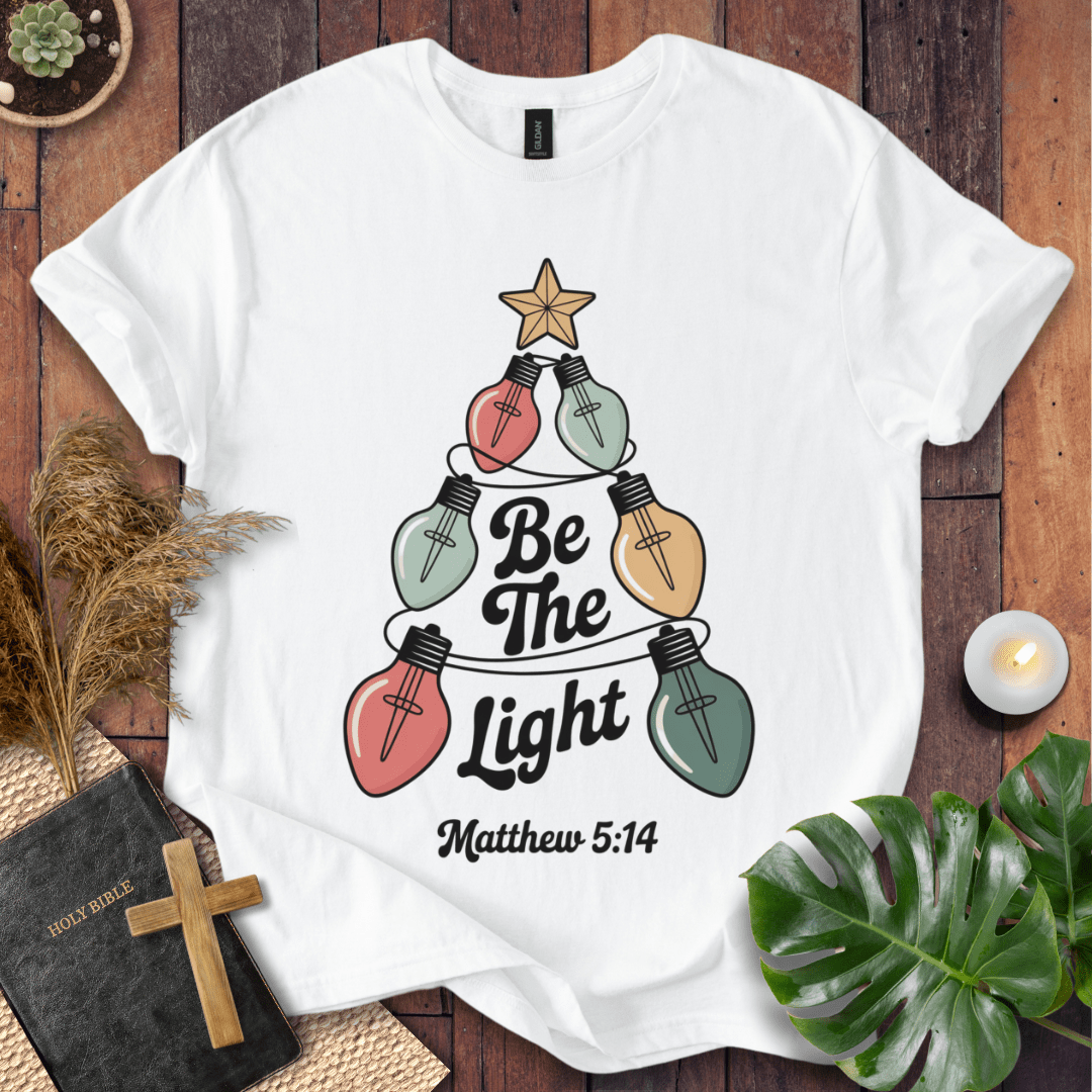 Faith Christmas shirt encouraging believers to shine their light – religious holiday tee