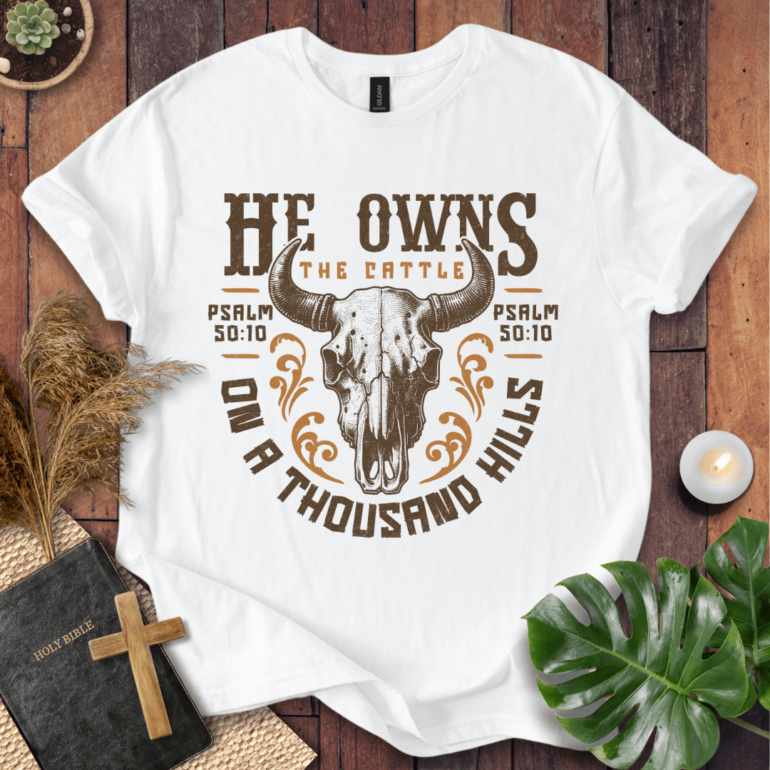 Christian t shirt for women featuring a longhorn skull and Psalm 50:10 He owns the cattle on a thousand hills.