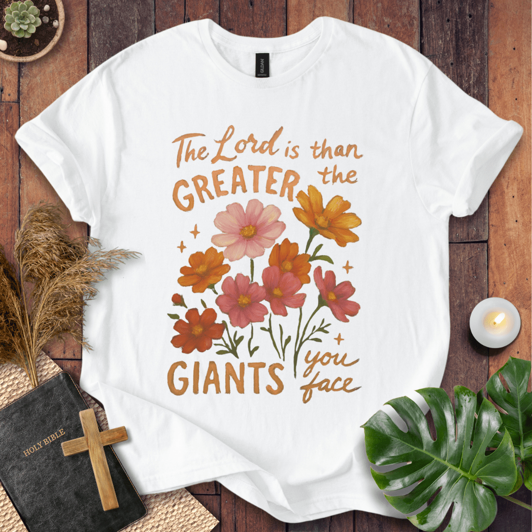 “The Lord is greater than the giants you face” floral lettering Christian t-shirt; uplifting faith tee.
