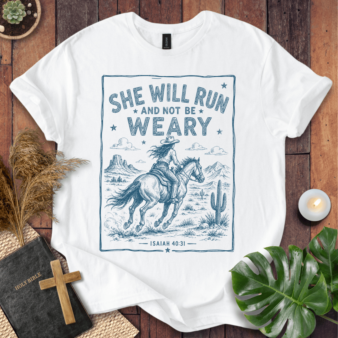 graphic tee with a blue sketch of a cowgirl riding a horse in the desert under Isaiah forty thirty-one text.