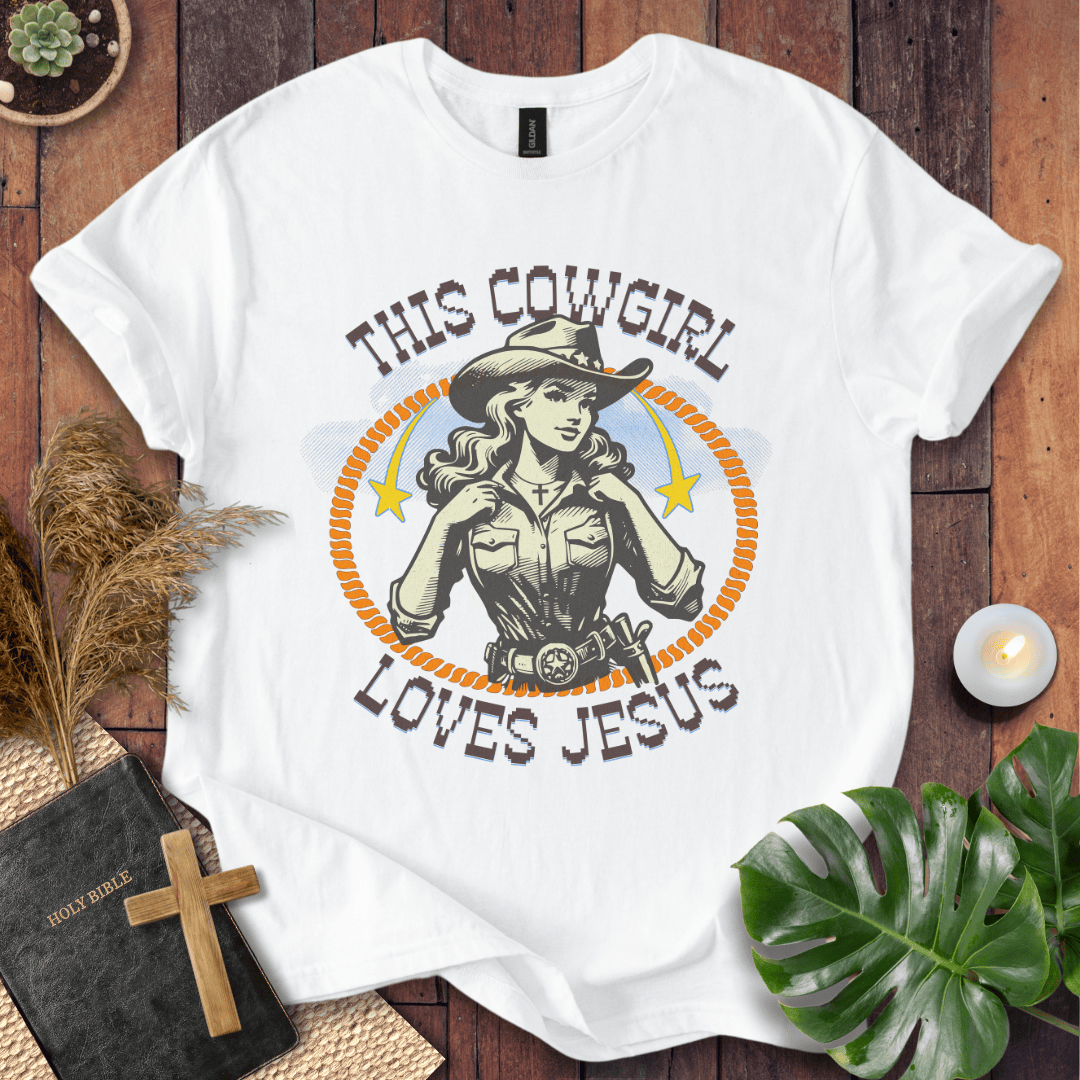 Christian t-shirt featuring a vintage cowgirl illustration with a lasso and the text This Cowgirl Loves Jesus.