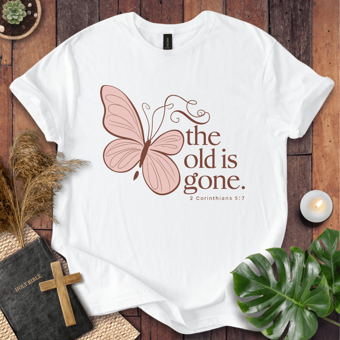 t-shirt with a dusty rose butterfly and "the old is gone" 2 Corinthians 5:17 text in brown ink.