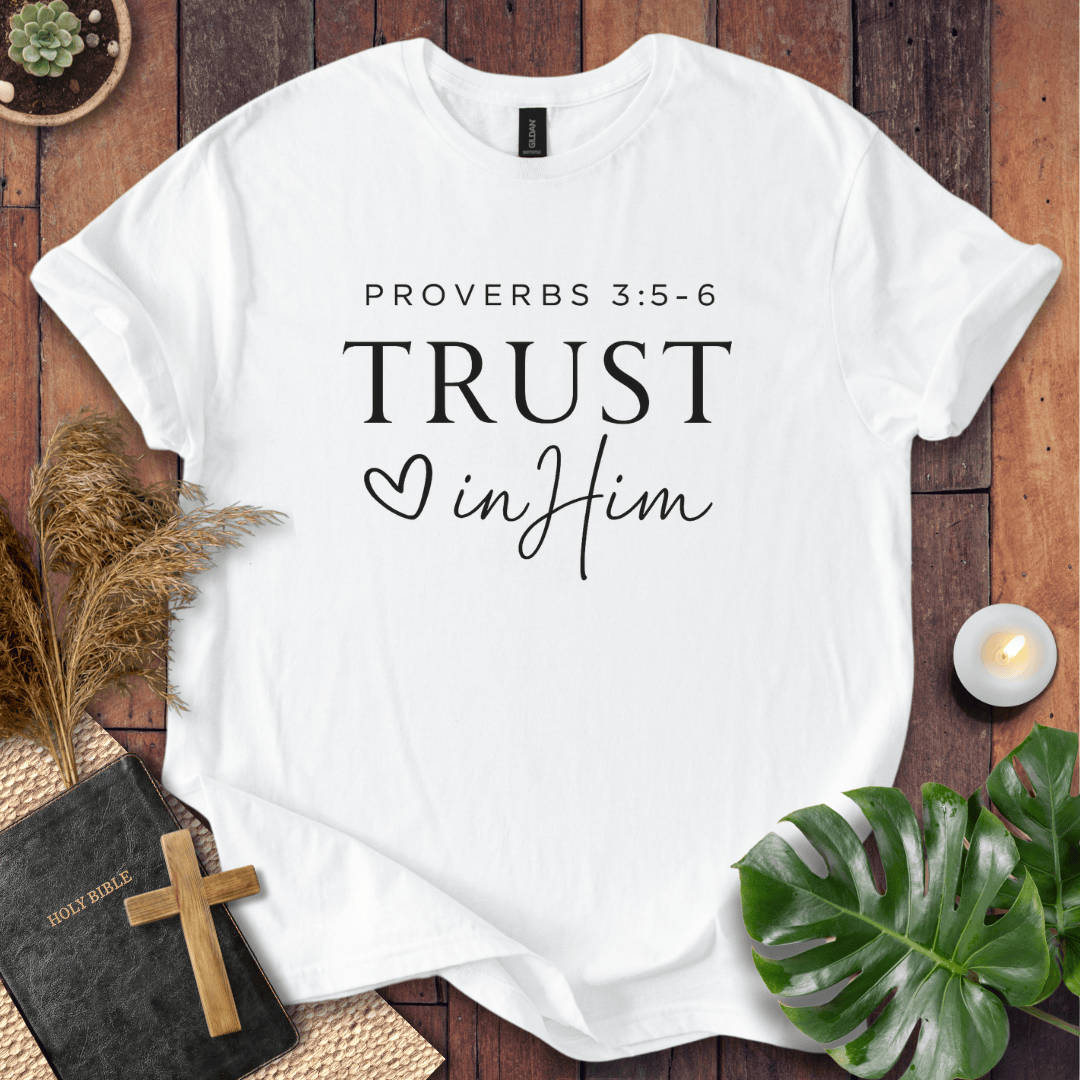 Minimalist Proverbs 3:5-6 Trust in Him shirt for women, a boho style bible verse t shirt on a wooden background.