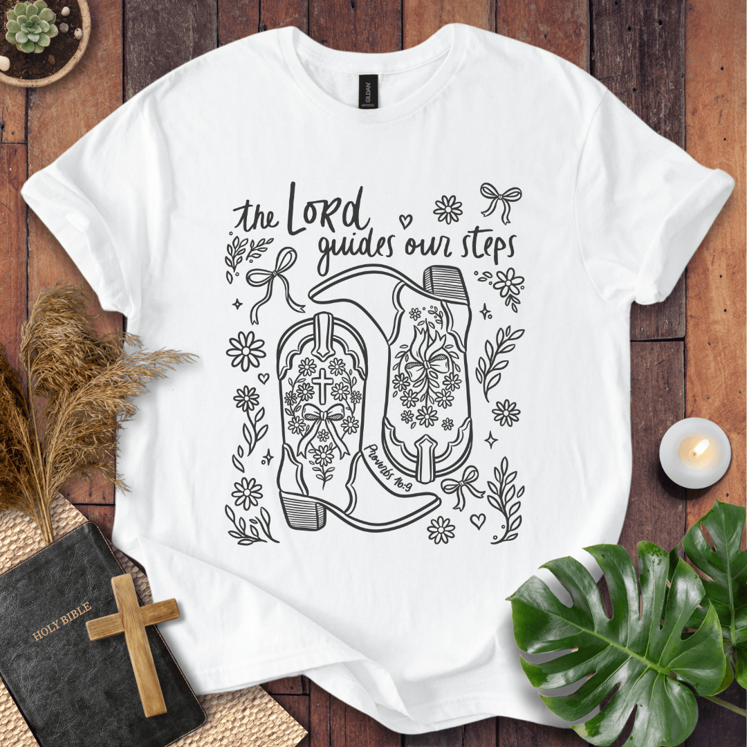Line art cowboy boots with flowers and bows on a t shirt featuring Proverbs 16:9 "The Lord guides our steps."