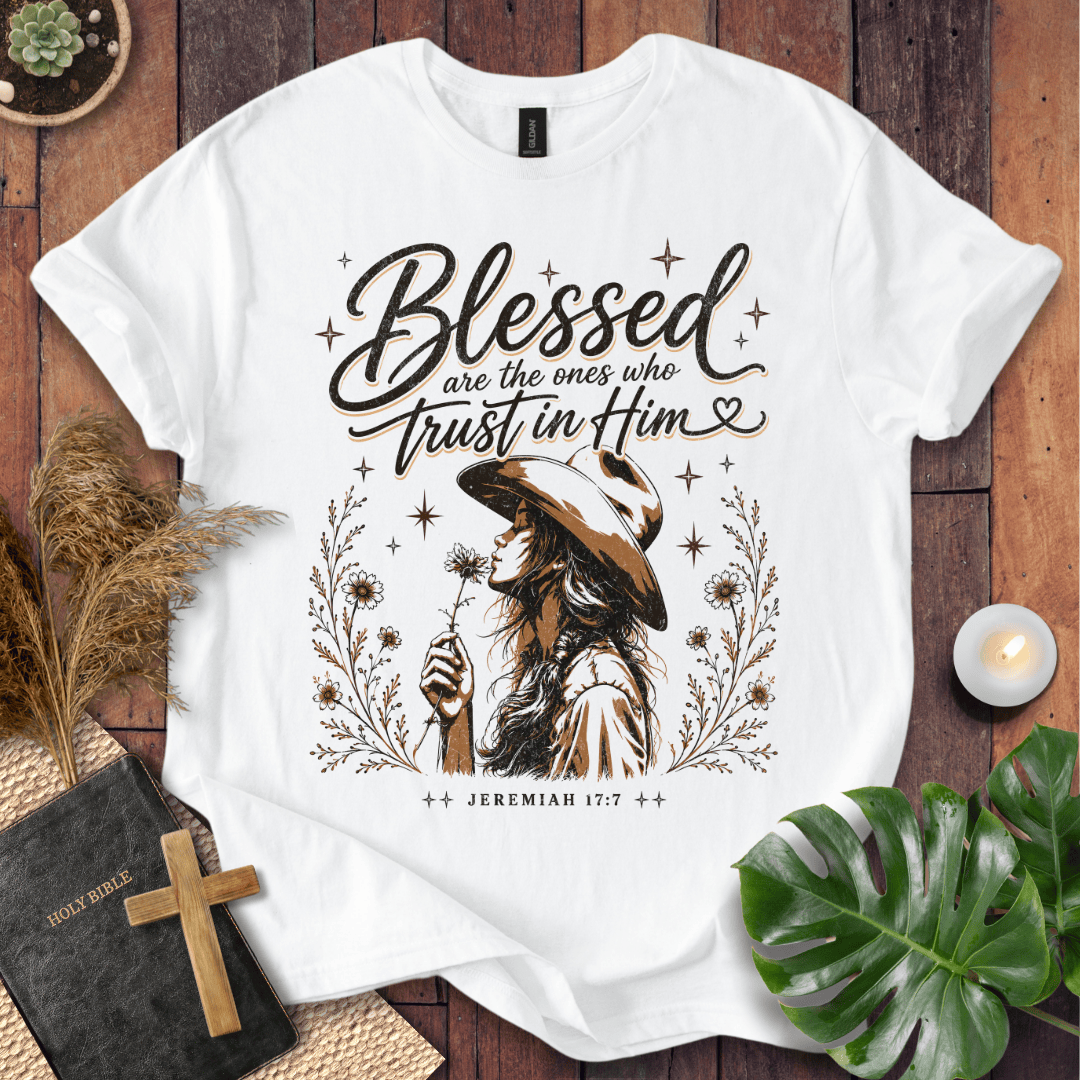 Jeremiah 17:7 sand t-shirt featuring a western woman in a cowboy hat holding a flower with stars and branches.