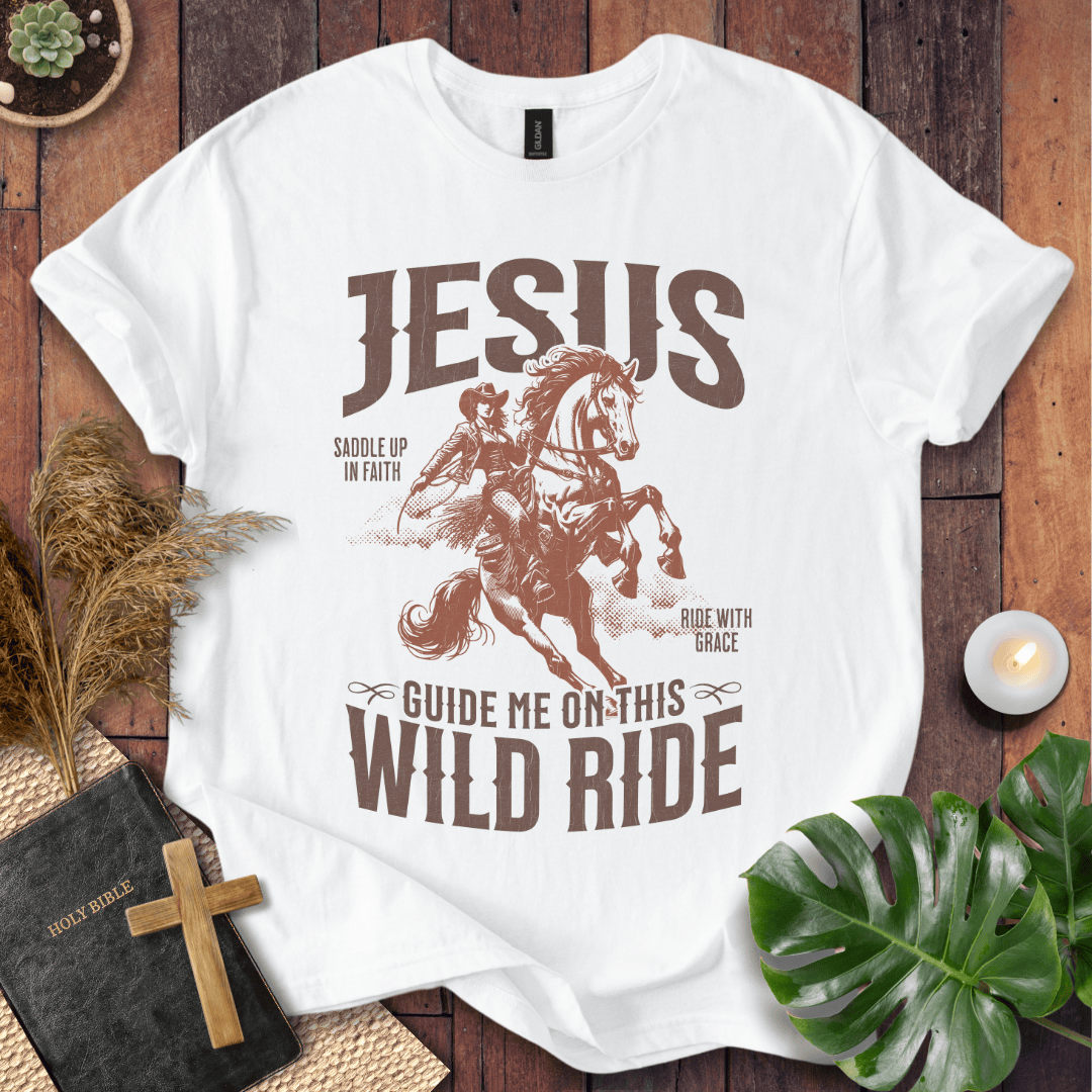 White t-shirt with graphic design featuring a horse and text on a wooden surface.